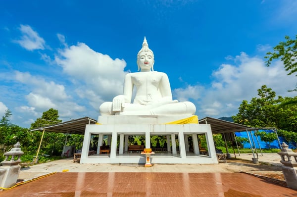 white buddha statue in wat chom tham at mea on in chiang mai thailand