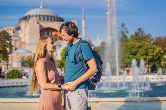 Happy Couple Of Tourists In The Honeymoon In Istanbul Enjoy Beautiful View On Hagia Sophia