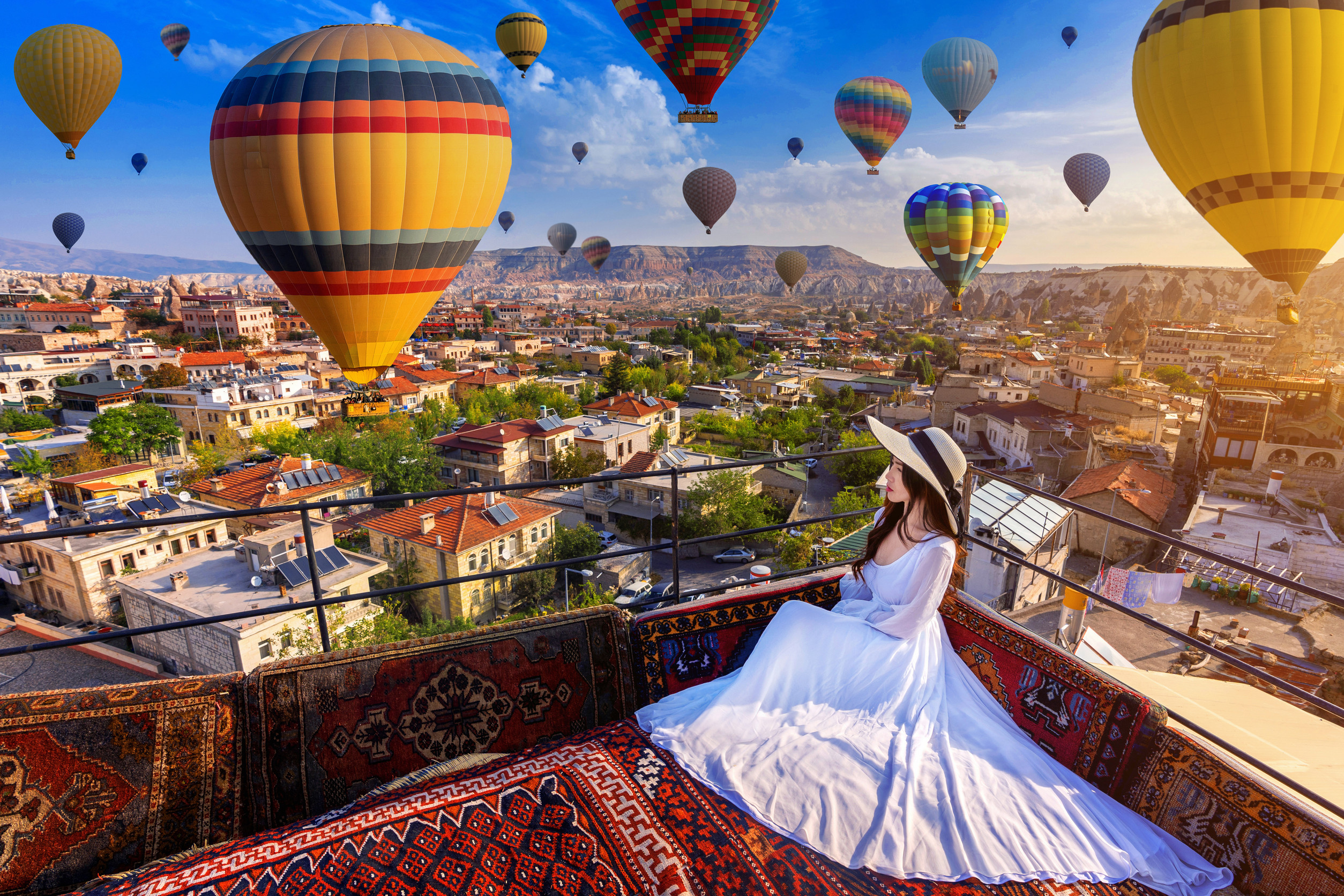 Beautiful Girl Looking At Hot Air Balloons In Cappadocia