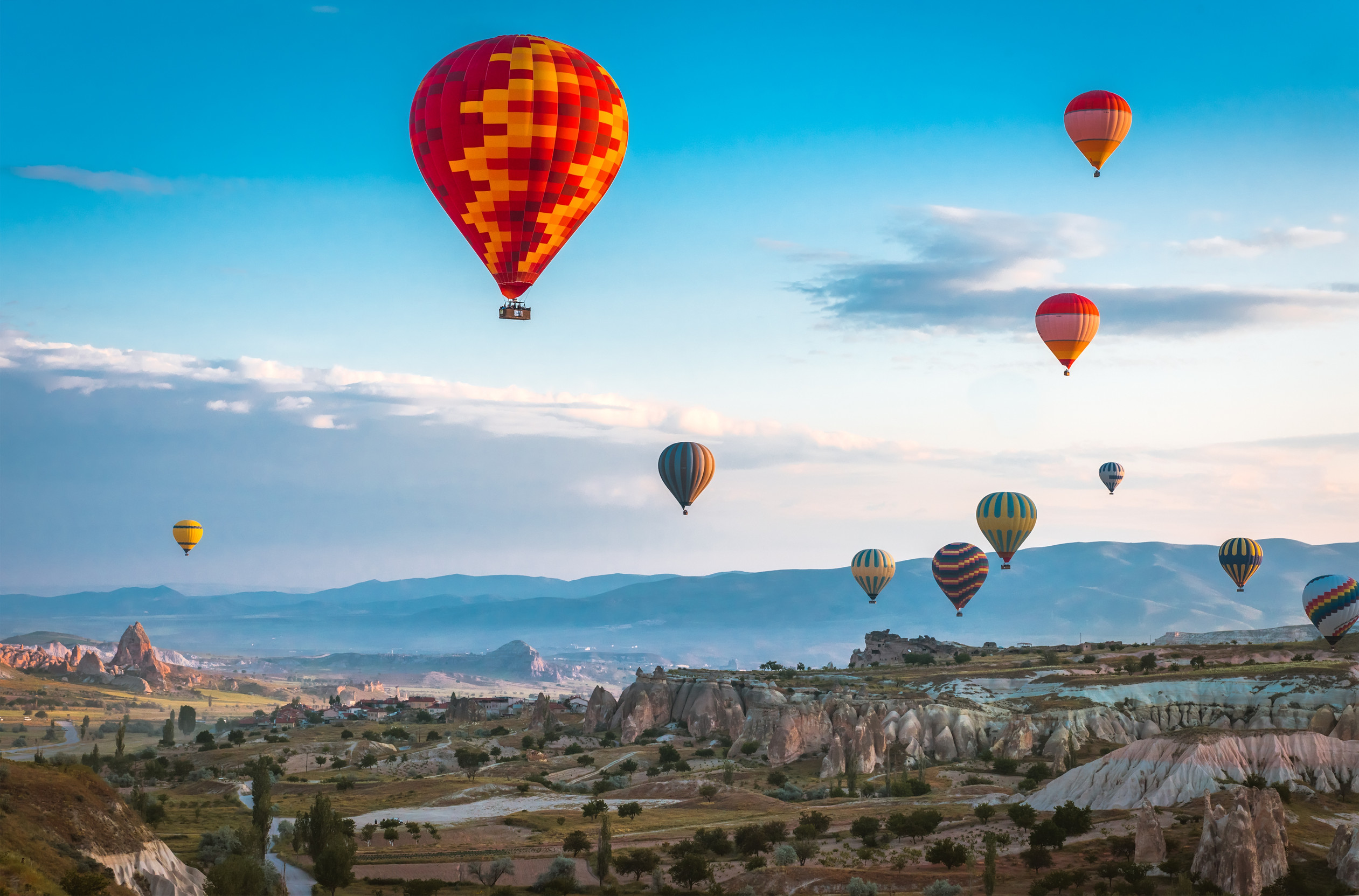 Red Hot Air Balloon Flying Over Cappadocia