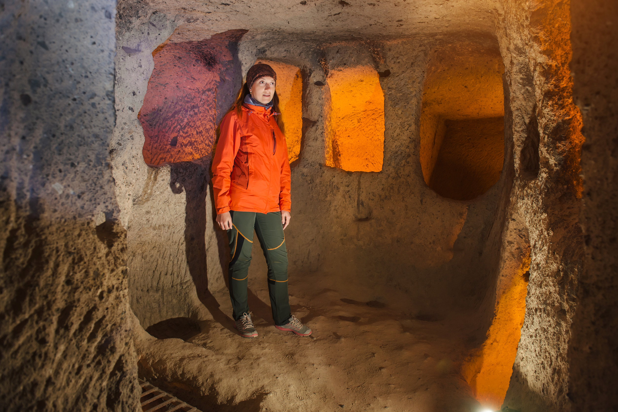 Tourist Exploring The Underground Cave City In Cappadocia